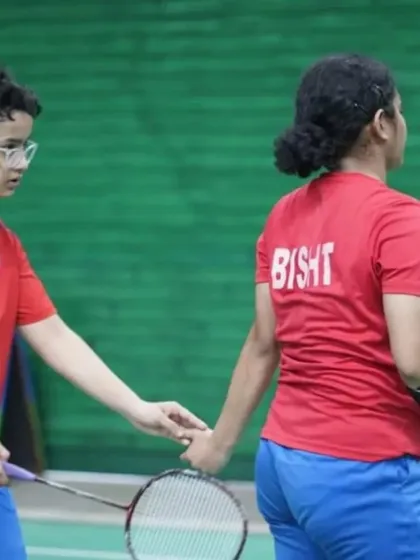 A candid moment of partnership between two of our players during the CBSE Nationals. We emphasize teamwork and mutual support on and off the court.