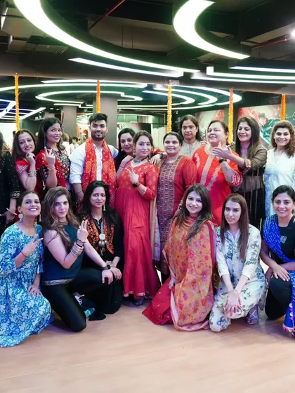 A group of enthusiastic participants at a Dandiya event. I love seeing everyone dressed up and ready to dance, creating a truly festive and colorful atmosphere.