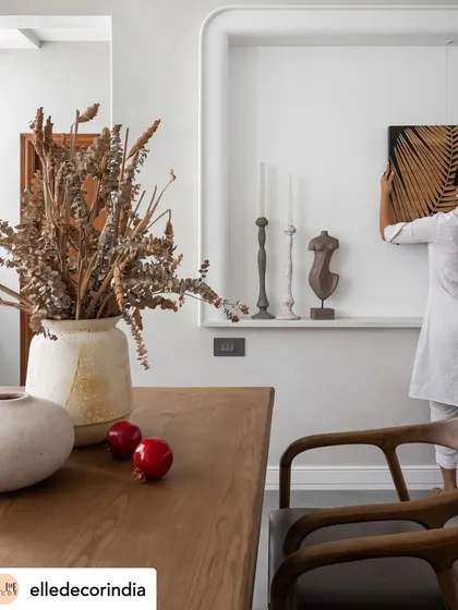 The final styling is where the real magic happens. Here, we are placing the final art piece in a custom-designed wall niche. These small, intentional acts of curation are what transform a house into a home, ensuring every corner tells a part of your story.