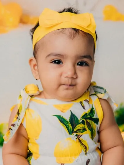 A beautiful portrait of our lemonade girl. The bright yellow bow is the perfect accessory for this theme.