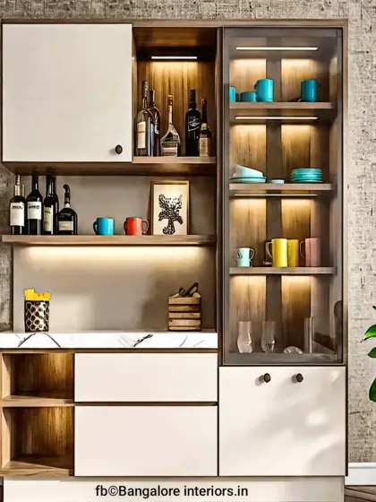 A closer look at a modern crockery unit, showcasing the combination of wood, white cabinets, and a glass display section. The integrated lighting adds warmth and highlights the items inside.