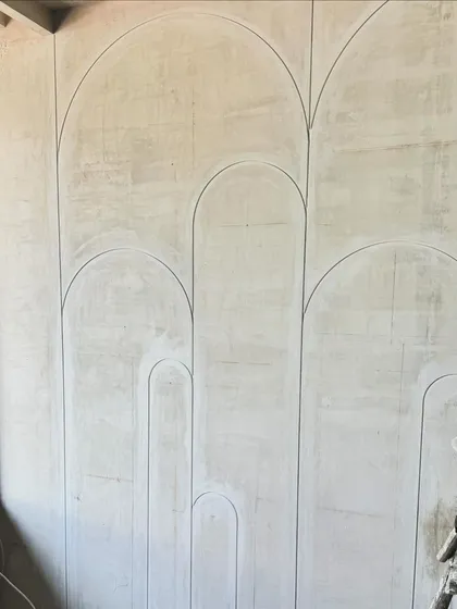 We love the simplicity of these clean, curved lines being grooved into the wall. This pattern of interlocking arches will add a subtle, elegant detail to the finished space.