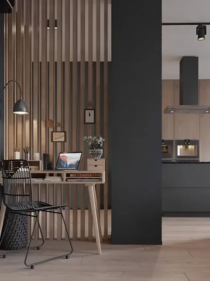 A cozy study area created next to a modern kitchen. We used a wooden slat partition to provide a sense of separation while maintaining an open and connected feel, perfect for a compact apartment.