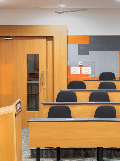 A close-up of the tiered seating and acoustic wall panels at GL Bajaj University. Every element is planned to create an immersive setting where learning can thrive.