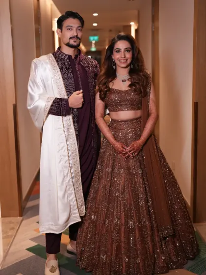 This is what it's all about: a perfectly styled couple, confident and happy. I worked with this lovely bride and groom to create complementary looks that reflect their individual personalities while looking stunning together. This is the result of careful planning, from the bride's shimmering lehenga to the groom's coordinated sherwani.