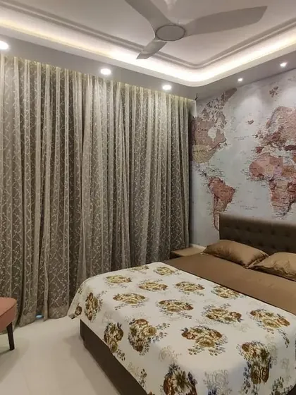 A well-designed room should have space for your passions. We ensured this bedroom layout included a cozy corner for our client to relax with their guitar, demonstrating how we incorporate personal lifestyle elements into our interior designs.