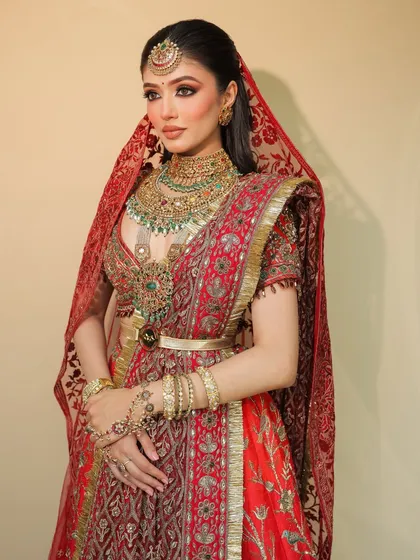 Another angle of this stunning bridal look, showing how the makeup complements the entire ensemble, from the dupatta setting to the exquisite jewelry.