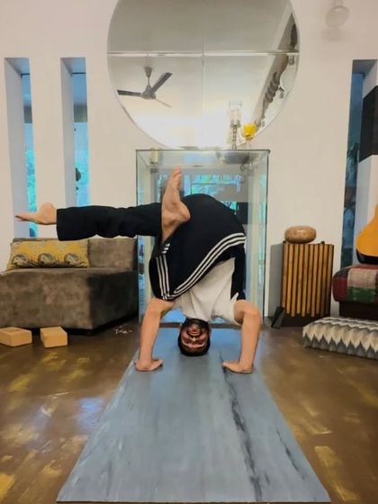 A variation of Sirsasana (Headstand) that incorporates a twist and a leg bind, adding a new layer of complexity and challenge.