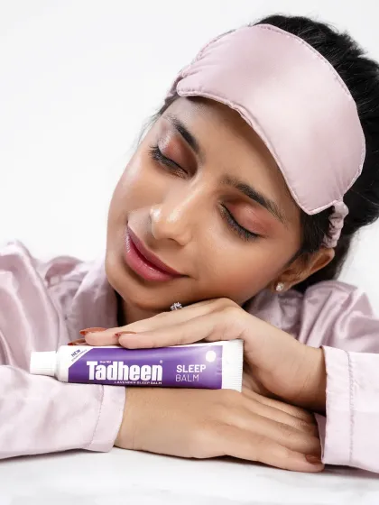 A serene beauty shot for the Tadheen sleep balm. The model's peaceful expression and closed eyes perfectly convey the sense of calm and relaxation associated with the product.