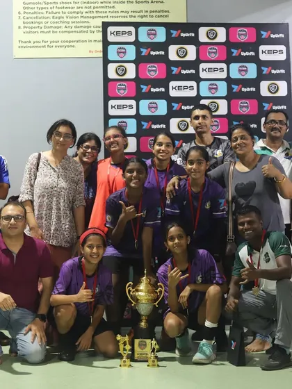 Our U15 team with coaches and parents after winning the KEPS futsal tournament, a victory for the whole Knights community.