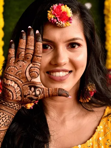 Here is one of my beautiful 'pataka' brides, absolutely radiant and happy during her mehendi ceremony. Seeing this smile is the best part of my job.
