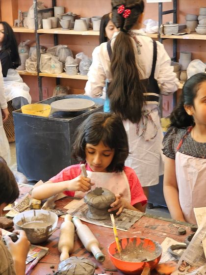 This young artist is carefully carving details into her hand-built piece during our summer camp. It's amazing to see the intricate ideas kids come up with when they have clay in their hands.