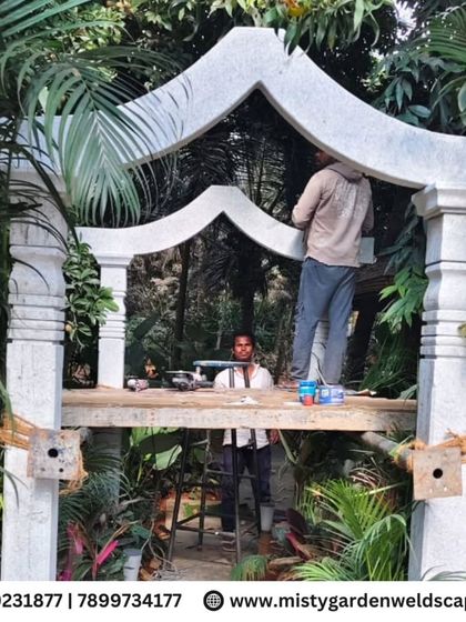 The final touches are applied to the stone arch, showcasing the precision and care we put into every structural element we build.
