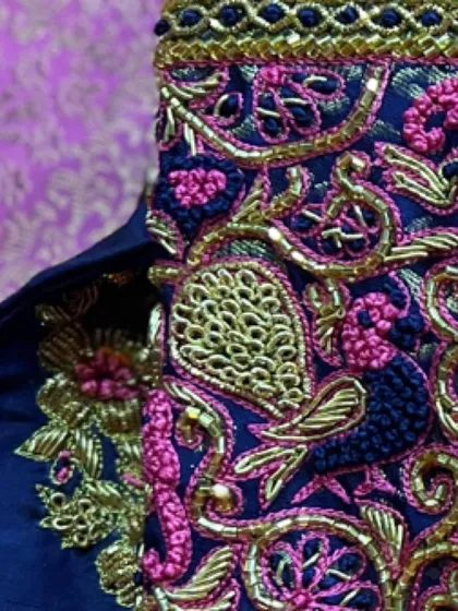 Another angle showcasing the beautiful blend of pink and gold threadwork on a navy blue base. This color combination is both bold and traditional.