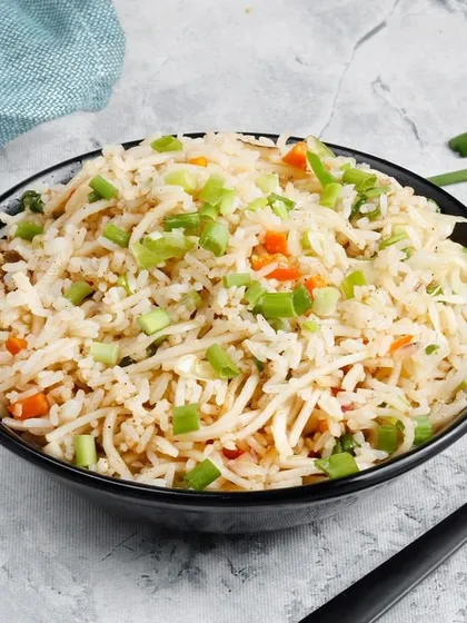 Simple, classic, and delicious Vegetable Fried Rice. This dish is lightly seasoned and stir-fried with carrots and spring onions, making it the perfect companion to any of our gravies or starters.
