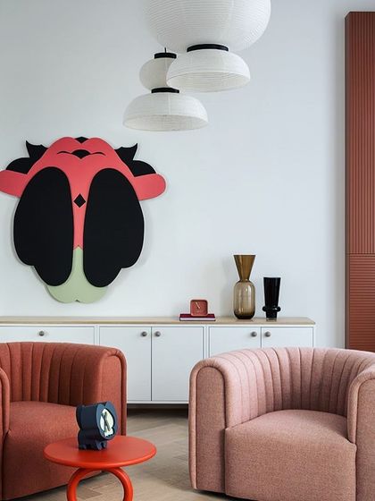 What could be more luxurious than a nice sofa? This image showcases how we can help you select the perfect furniture, like these stylish accent chairs, to create a comfortable and chic living space.