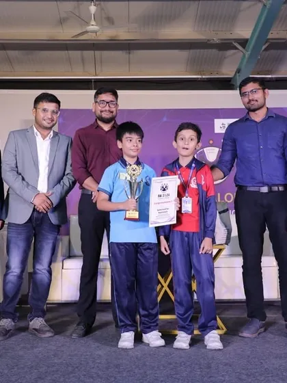 Even our youngest students are competing and winning on stage. These young champions are holding their trophies and certificates after showcasing their robotics projects. We believe in empowering kids early with the skills to innovate and lead in the tech world.