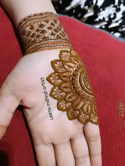 The start of a half-mandala design. This style is perfect for guests who want a quicker application while still getting a beautiful, intricate pattern.