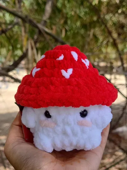 This is my classic Mushy Boi, a crochet mushroom plushie. I made the red cap a little bigger on this one because I think it looks extra adorable that way.