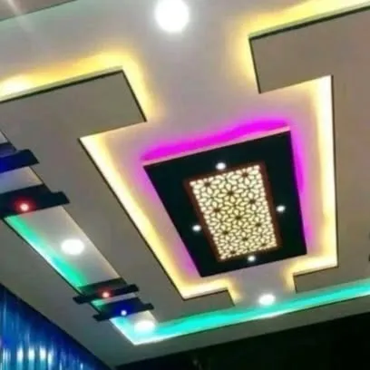 A modern design with a decorative twist. The central panel features a backlit jali pattern, surrounded by multi-colored cove lighting for a vibrant and stylish look.