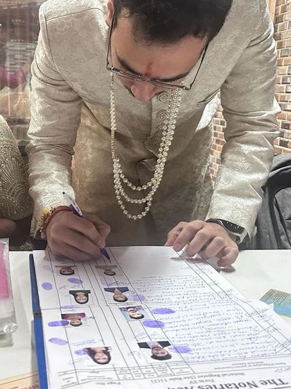A close-up of the groom signing the official notary register, a crucial step in the court marriage process. I manage all the details to ensure every document is perfect.