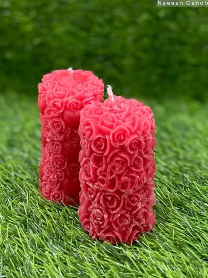 Ignite warmth and charm. This red floral pillar candle is a statement of elegance, perfect for cozy nights.