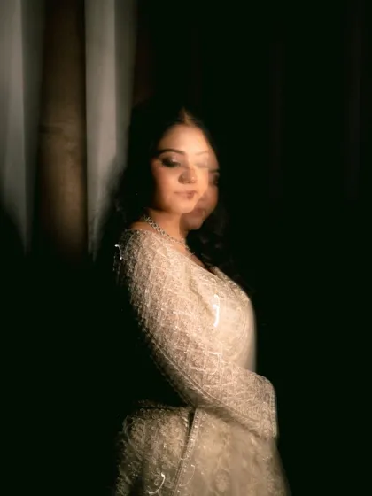 A moody and artistic portrait of the bride, with motion blur creating a sense of mystery and elegance.