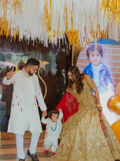 The birthday boy and his parents making a grand entrance. We love creating moments of joy and celebration for the whole family at our kids' parties.