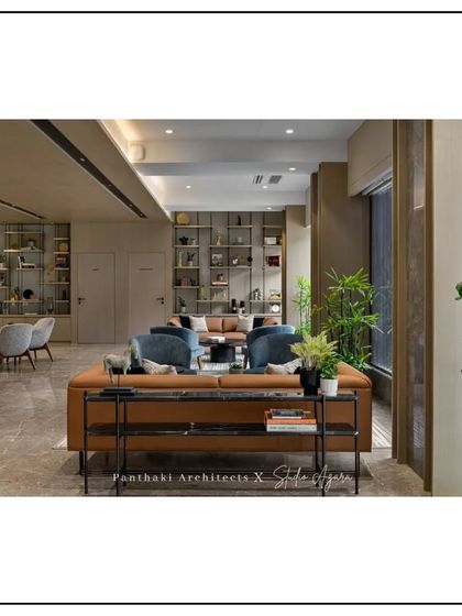 This expansive lounge offers a variety of seating options, from sofas to armchairs, catering to both individual work and group discussions in a stylish, open environment.