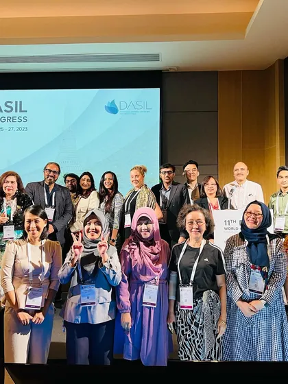 A group photo with fellow moderators and speakers on stage at DASIL Bangkok 2023.