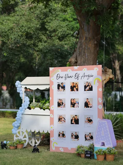 Another view of the "One Year of Arzoie" milestone board, showcasing the beautiful photos from her first year in a personalized and themed display.