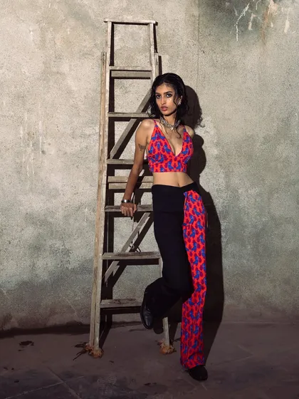 Using a rustic ladder as a prop against a raw, concrete wall. This shoot was about finding fashion in unexpected, industrial settings.