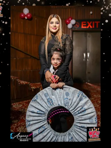 A fun and creative pose from one of our hula hoop stars backstage, ready to light up the stage.