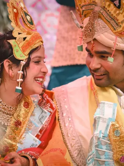 A joyful, candid moment between the bride and groom during their traditional Pahadi wedding ceremony.