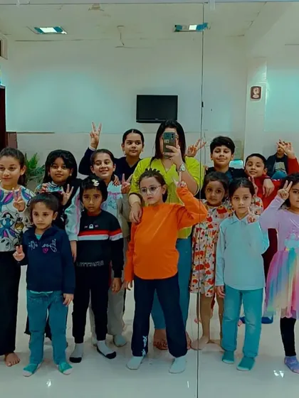 A quick snap with our amazing young dancers. We're not just a dance academy; we're a family that learns, grows, and makes memories together.