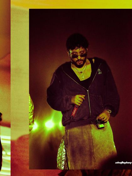 A close-up of Encore ABJ from Seedhe Maut during a live performance. The warm, grainy filter adds to the raw, underground vibe of the shot.