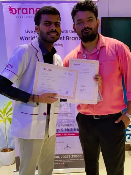 A happy student receives his certification. This moment represents the culmination of his hard work and the beginning of a promising new career.