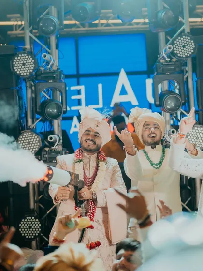 The groom makes a fun, high-energy entrance at the after-party, complete with a CO2 smoke gun. We plan celebrations that last all night long.