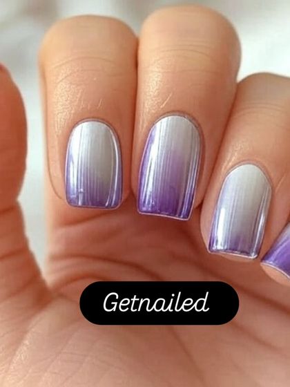 A stunning example of purple and silver chrome ombre. The colors blend seamlessly for a metallic, futuristic effect that is both bold and beautiful.