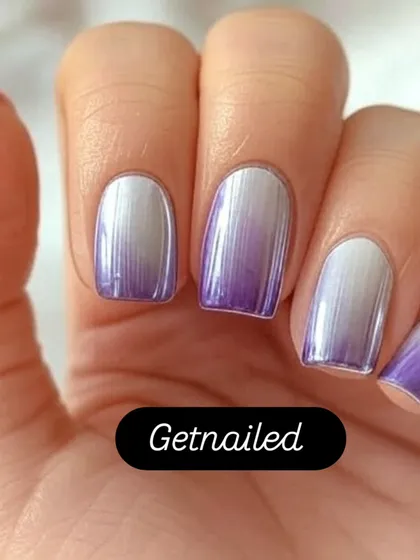 A stunning example of purple and silver chrome ombre. The colors blend seamlessly for a metallic, futuristic effect that is both bold and beautiful.
