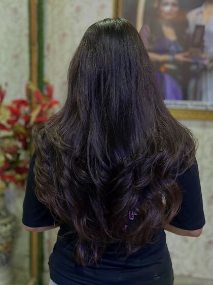 The final result of a professional layered haircut and blowout. Notice the volume, shape, and healthy shine, all key elements of a high-quality finish that I teach my students to achieve.