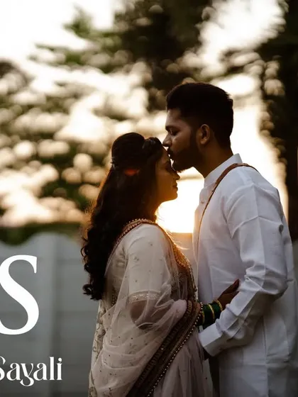 A silhouette of the couple against the setting sun, a classic and romantic shot from their wedding day.