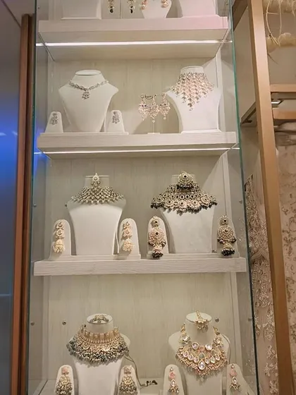My jewellery display case, filled with sparkling options. From chokers to layered necklaces, find the perfect piece to rent with your outfit.