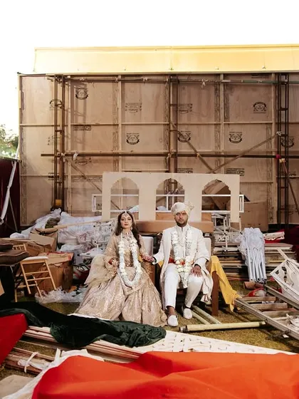 Love in the midst of creation. This editorial shot of Aashvi and Draksh, set against the beautiful chaos of their wedding setup, shows our passion for finding art in unexpected places.