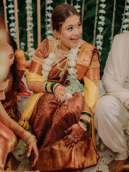 The bride's spontaneous, joyful laughter during the ceremony. Capturing these unscripted moments with family is what makes wedding photography so special.