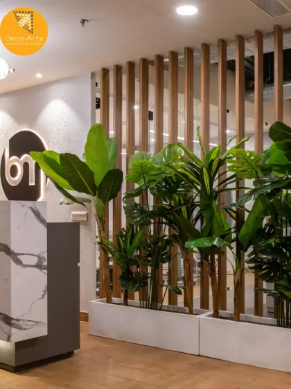 Natural elements soften the modern aesthetic at the Brandman reception. We used lush planters as a natural divider, creating a welcoming transition from the entrance to the main workspace.