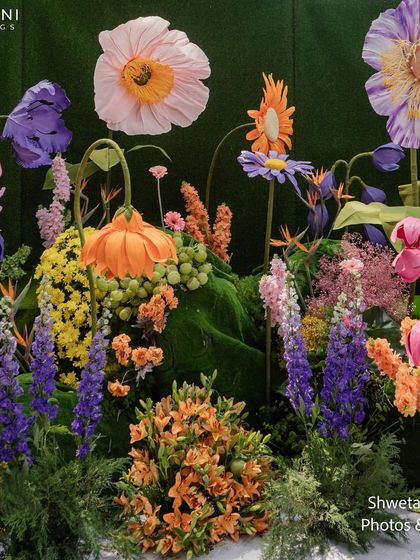 A detailed view of the floral arrangements on the "Bloom" wedding stage, showing the artistry and mix of colors and textures used to create this fantasy garden.