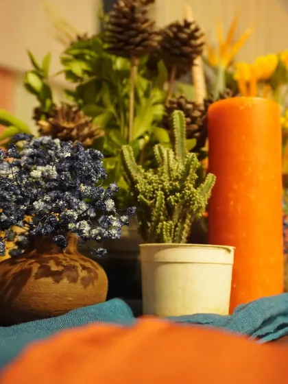 We used mini cacti, dried oranges, and cinnamon sticks in our 'Moroccan Nightfall' table styling. These small, textural details helped to create an authentic, sensory experience for the guests.