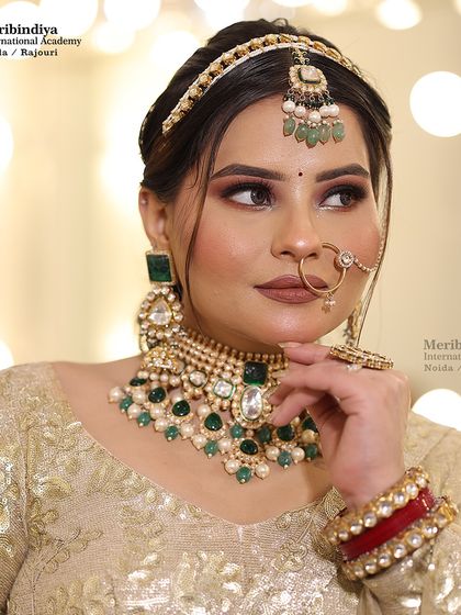 This portrait highlights the contour and highlight on the model, creating a sculpted, glamorous look perfect for evening receptions.