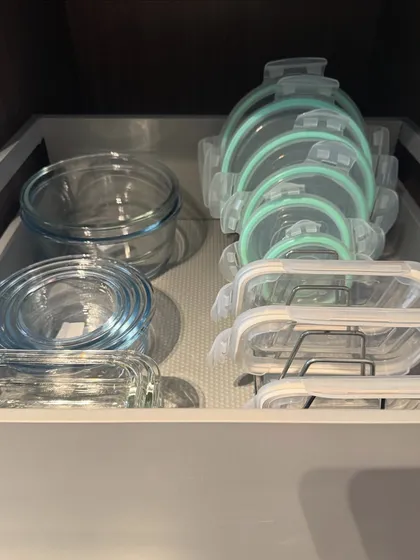 A drawer dedicated to food storage containers. We file the lids vertically in a rack, which is the best way to keep them organized and easy to match with their containers.